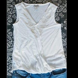 White lucky tank with embroidery detail.